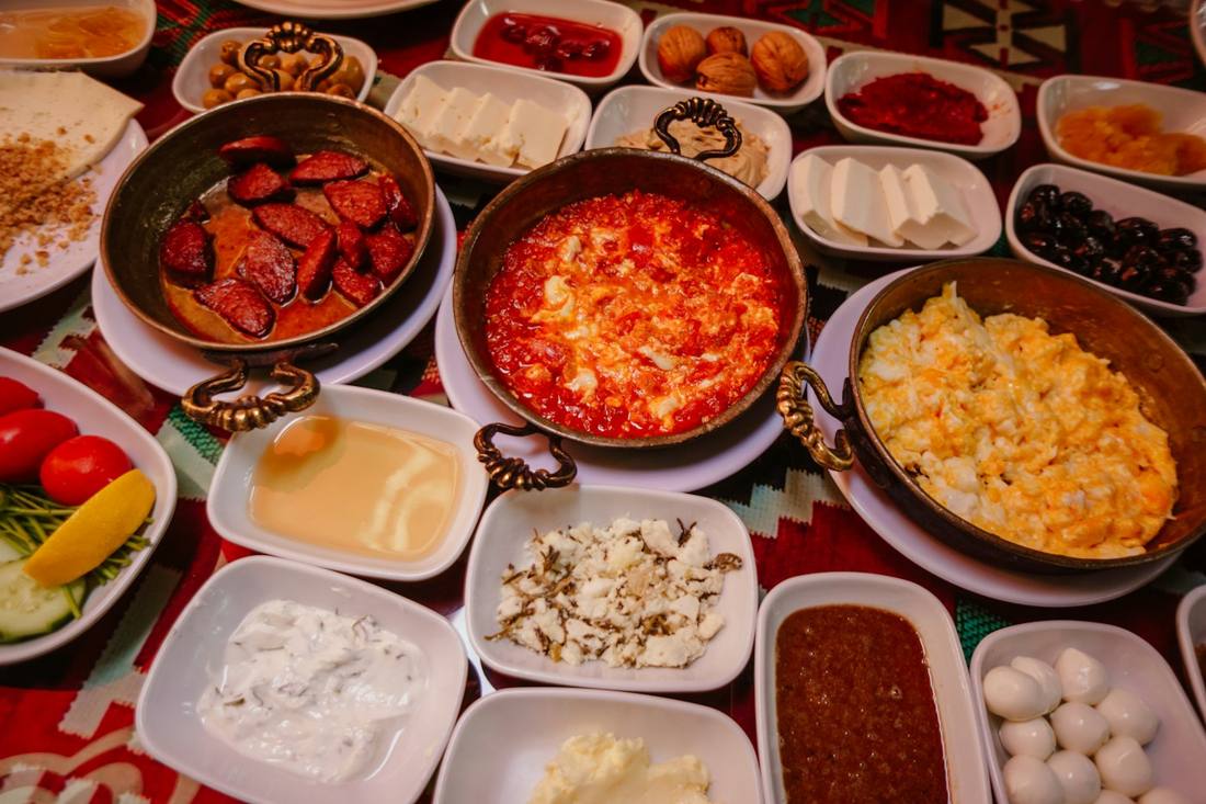 Serpme breakfast with menemen, sucuk, cheeses and olives